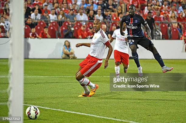 Paris St. Germain forward Jean-Kevin Augustin scores a goal past Benfica defender Luisao in the first half of an International Champions Cup game at...