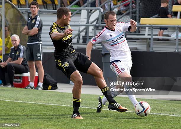 Chris Klute of the Columbus Crew SC and Harry Shipp or the Chicago Fire during the first half of the game between the Chicago Fire and the Columbus...