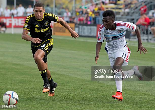 Chris Klute of the Columbus Crew SC and David Accam or the Chicago Fire during the first half of the game between the Chicago Fire and the Columbus...