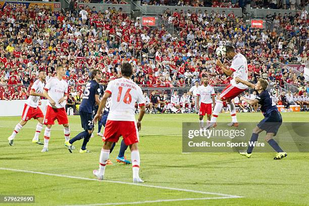 Benfica midfielder Andreas Samaris heads the ball during the Guinness Cup game between SL Benfica and Paris Saint-Germain F.C. At BMO Field in...