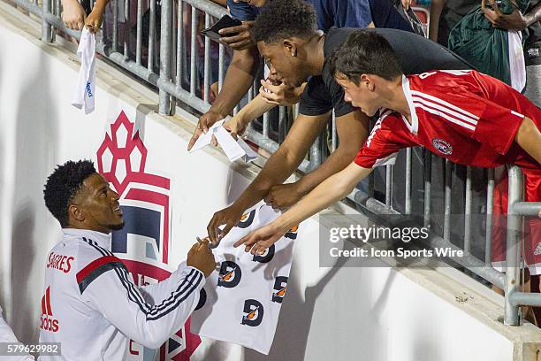 Benfica defender Eliseu signs autographs for the fans after the Guinness Cup game between SL Benfica and Paris Saint-Germain F.C. At BMO Field in...