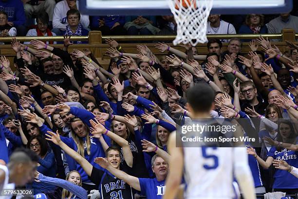 Duke fans try to disrupt a freethrow by the other team. The Duke University Blue Devils hosted the Furman University Paladins at Cameron Indoor...