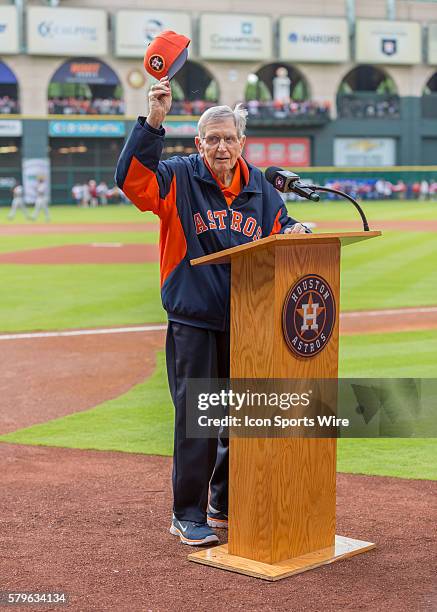 Radio announcer Milo Hamilton addresses the fans during the MLB opening day game between the Cleveland Indians and the Houston Astros at Minute Maid...