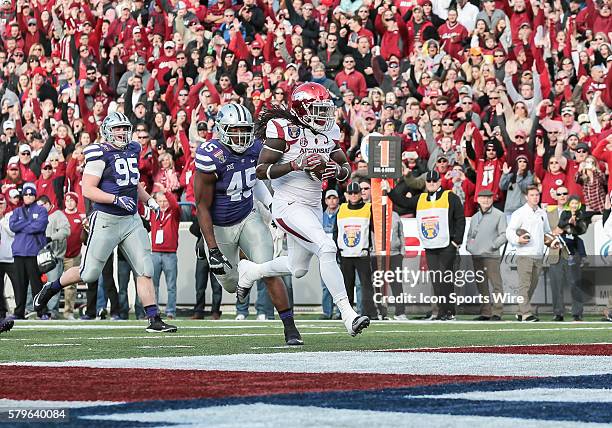 Arkansas Razorbacks running back Alex Collins scores a touchdown during an NCAA football game between the Kansas State Wildcats and the Arkansas...