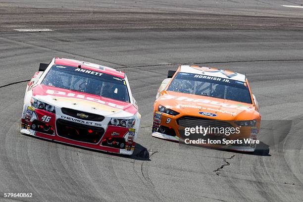 Michael Annett and Sam Hornish Jr. Race through turn 2 during the 5-hour ENERGY 301 at New Hampshire Motor Speedway in Loudon, NH.