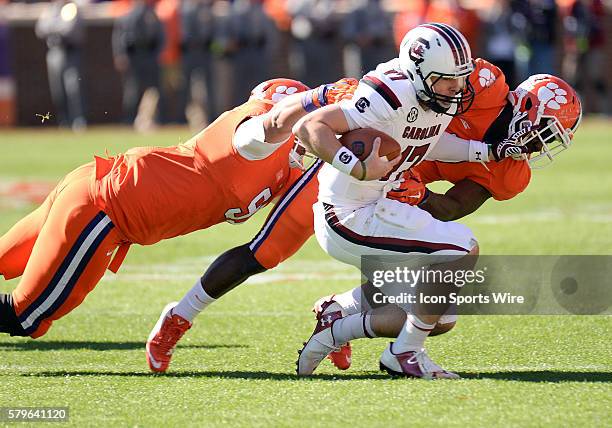 South Carolina quarterback Chaz Elder is pulled down during 1st half action between the Clemson Tigers and South Carolina Gamecocks at Memorial...