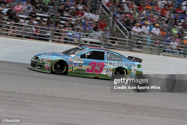 Alex Kennedy, driver of the Dream Factory Chevy in turn 4 during the running of the NASCAR Sprint Cup Series Duck Commander 500 at Texas Motor...