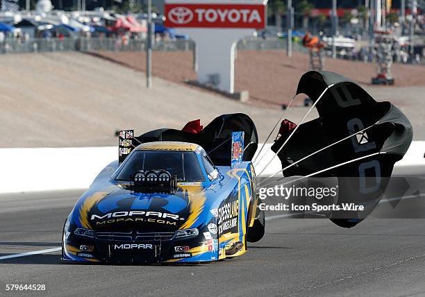 Matt Hagan DSR Dodge Charger NHRA Funny Car deploys his drag racing parachute during the 16th Annual SummitRacing.com NHRA Nationals at The Strip at...