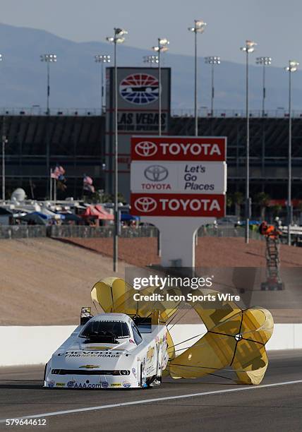 John Force Chevrolet Camaro NHRA Funny Car deploys his drag racing parachute during the 16th Annual SummitRacing.com NHRA Nationals at The Strip at...