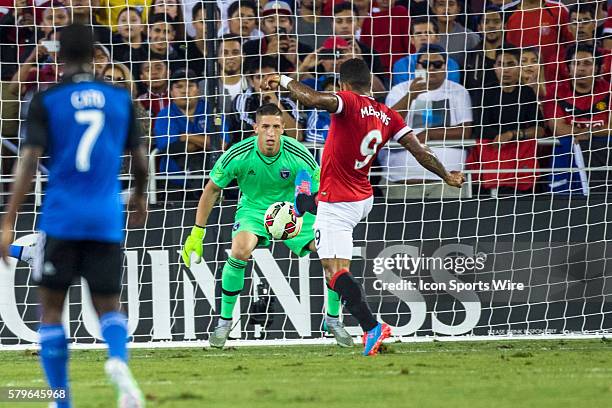 Manchester United midfielder Memphis Depay attempts to toe in a shot on goal by Manchester United forward Juan Mata , who scored in the 32nd minute,...