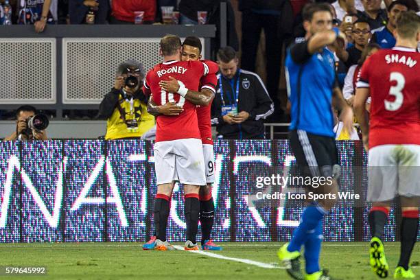 Manchester United midfielder Memphis Depay celebrates scoring in the 37th minute, with Manchester United forward Wayne Rooney , during the...