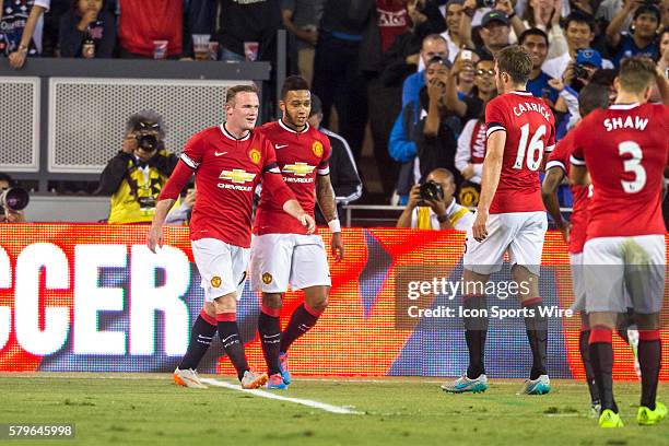 Manchester United midfielder Memphis Depay celebrates scoring in the 37th minute, with Manchester United forward Wayne Rooney , during the...