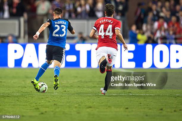 San Jose Earthquakes midfielder Leandro Barrera takes the ball down the pitch on a counter-attack, as Manchester United midfielder Andreas Pereira...