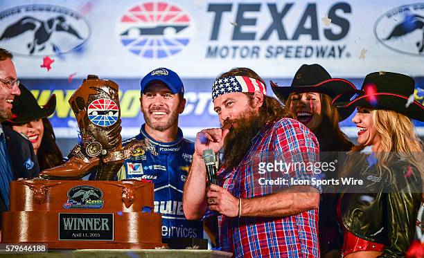 Apr 11, 2015- Ft. Worth, TX-- Willie Robertson blows into Jimmie Johnson's new duck call for winning the Duck Commander 500 at the Texas Motor...