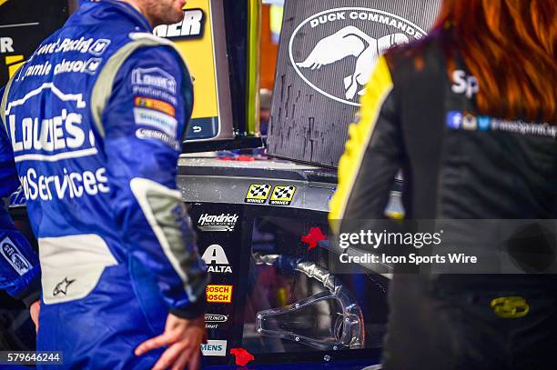 Apr 11, 2015- Ft. Worth, TX-- Jimmie Johnson places a second checkered flag sticker on the roof of his car at the Duck Commander 500 at the Texas...