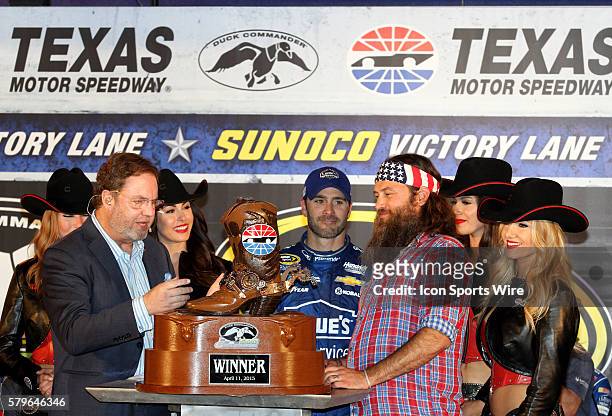 Jimmie Johnson, driver of the Lowes Pro Services Chevy celebrates winning the NASCAR Sprint Cup Series Duck Commander 500 at Texas Motor Speedway in...
