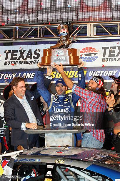 Jimmie Johnson, driver of the Lowes Pro Services Chevy celebrates winning the NASCAR Sprint Cup Series Duck Commander 500 at Texas Motor Speedway in...