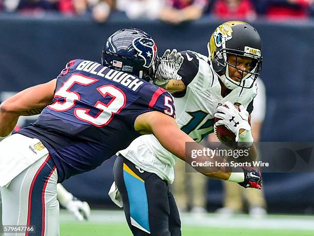 Jacksonville Jaguars Wide Receiver Rashad Greene attempts to stiff arm Houston Texans Linebacker Max Bullough during the Jaguars at Texans game at...