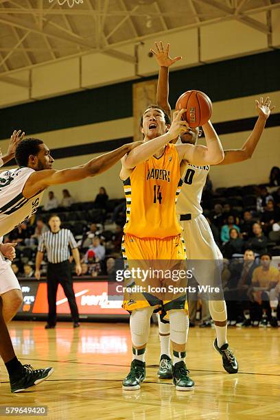 November 29 | Saturday: Michael Karena Center Wright State University Raiders attempts a two-pointer against Fred Miller Guard and Damian Goodwin...