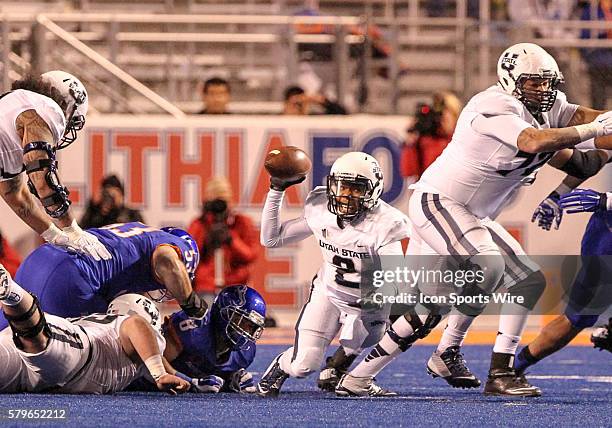 Utah State Aggies quarterback Kent Myers looking to dump the ball off during 1st half action between the Utah State Aggies and the Boise State...