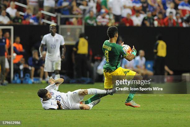 United States Defender Ventura Alvarado and Jamaica Forward Giles Barnes during the CONCACAF Gold Cup semifinal match between the United States and...