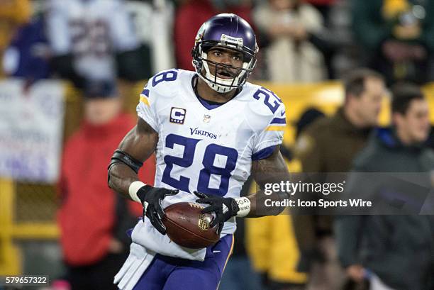 Minnesota Vikings Running Back Adrian Peterson [9379] in action during a game between the Green Bay Packers and the Minnesota Vikings at Lambeau...