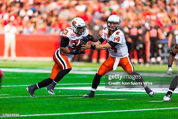 Lions Travis Lulay and Andrew Harris during Canadian Football League action between the BC Lions and Ottawa RedBlacks at TD Place in Ottawa, ON,...