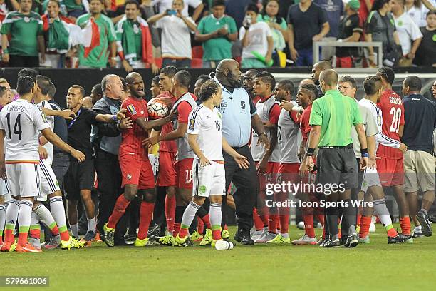 Benches clear after a late Panamanian penalty which allowed Mexico Midfielder Andres Guardado to score on a penalty kick as time expired in...