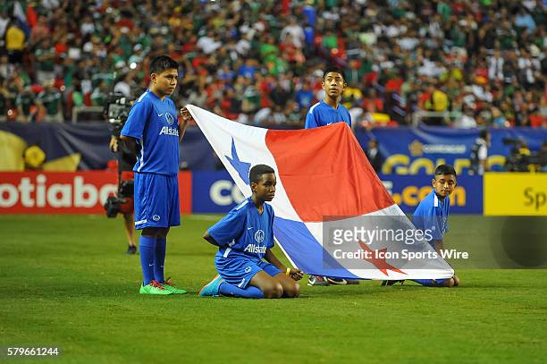 The Panamanian flag is presented before the CONCACAF semifinal match between the Panama and Mexico at the Georgia Dome in Atlanta, GA. Mexico won 2-1...