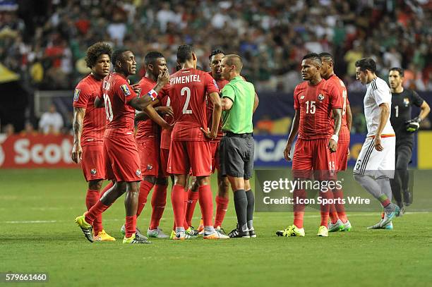 Panama Defender Roman Torres pleeds with Referee Mark Geiger after he called a red card on Panama Forward Luis Tejada during the CONCACAF semifinal...