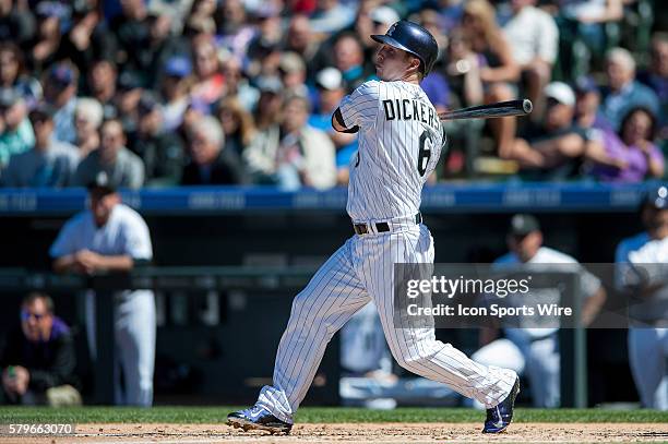 Colorado Rockies left fielder Corey Dickerson doubles during a regular season Major League Baseball game between the Chicago Cubs and the Colorado...