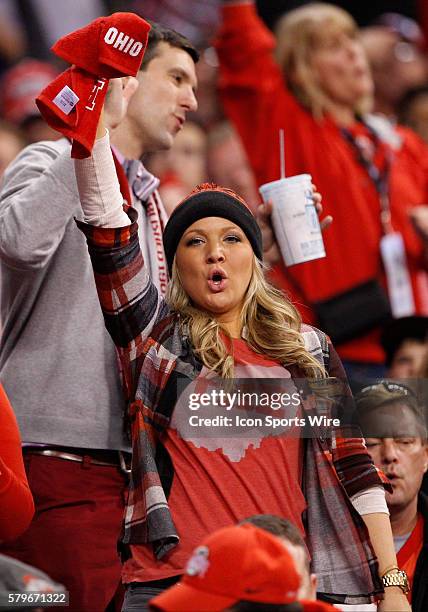 Buckeye fan shows her spirit during the Big Ten Championship Game between the University of Wisconsin Badgers and the Ohio State Buckeyes at Lucas...