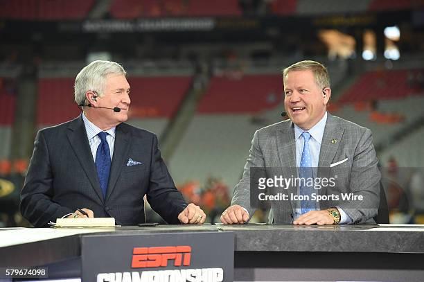 Former Texas head coach and ABC College Football Countdown analyst Mack Brown talks with Notre Dame head coach Brian Kelly on the set of the ESPN...