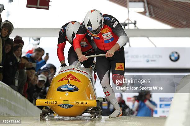 Driver Rico Peter and brakeman Janne Bror van der Zijde of Switzerland slide on the track to at the Olympic Sports Complex in Lake Placid, NY in the...