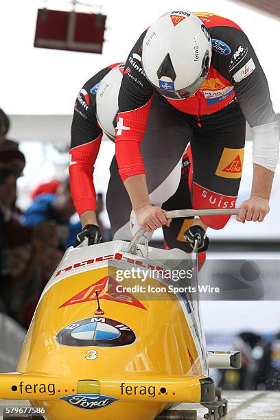 Driver Rico Peter and brakeman Janne Bror van der Zijde of Switzerland slide on the track to at the Olympic Sports Complex in Lake Placid, NY in the...