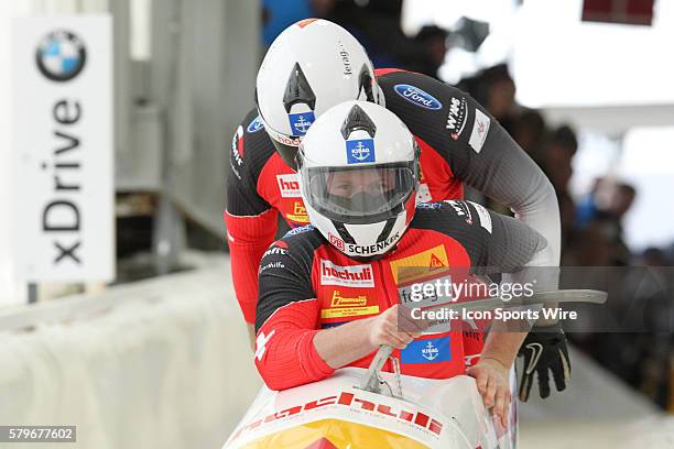 Driver Rico Peter and brakeman Janne Bror van der Zijde of Switzerland slide on the track to at the Olympic Sports Complex in Lake Placid, NY in the...