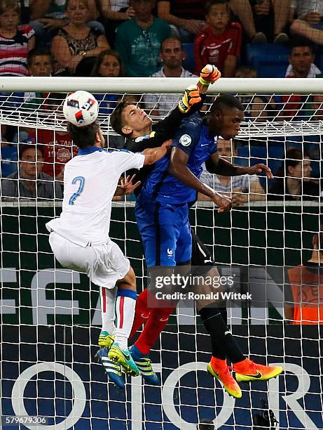 Issa Diop of France is challenged by Goalkeeper Alex Meret and Davide Vitturini of Italy during the UEFA Under19 European Championship Final match...