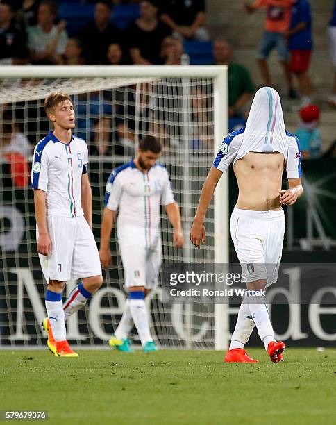 Manuel Locatelli of Italy looks disappointed under his shirt during the UEFA Under19 European Championship Final match between U19 France and U19...