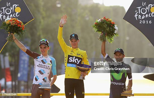 Chris Froome of Great Britain and Team Sky celebrates victory, Romain Bardet of France and AG2R La Mondial Team celebrates seond and Nairo Quintana...