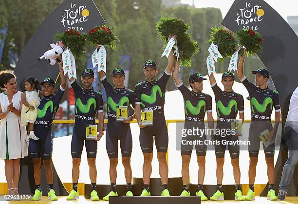The riders of Team Movistar celebrate winnig the team classification on the podium following stage twenty one of the 2016 Le Tour de France, from...