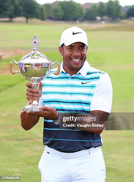 Jhonattan Vegas of Venezuela poses with the trophy after winning during the final round of the RBC Canadian Open at Glen Abbey Golf Club on July 24,...