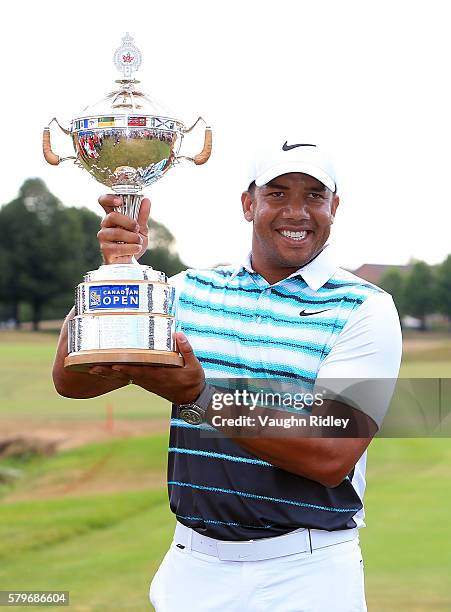 Jhonattan Vegas of Venezuela poses with the trophy after winning during the final round of the RBC Canadian Open at Glen Abbey Golf Club on July 24,...