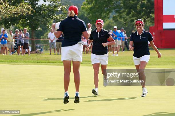 Cristie Kerr celebrates with Stacy Lewis and Gerina Piller of the United States after winning her singles matches of the 2016 UL International Crown...