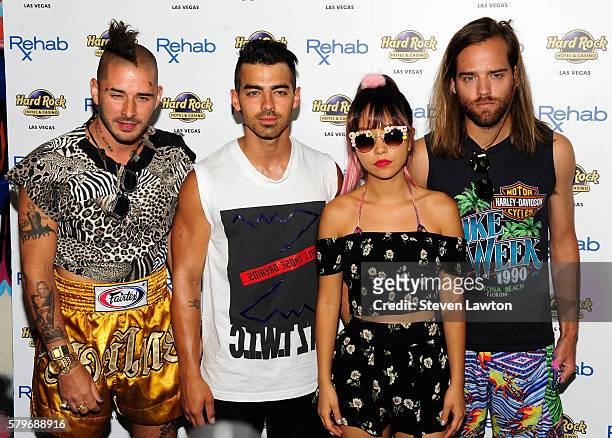 Musician Cole Whittle, singer Joe Jonas, musician JinJoo Lee and musician Jack Lawless of DNCE arrive at the Rehab Beach Club pool party at the Hard...