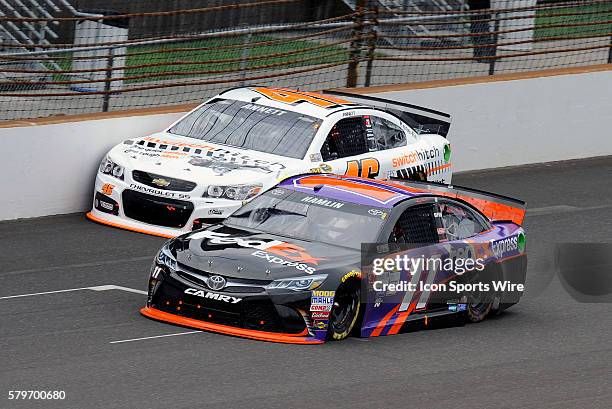 July 2015 | Denny Hamlin FedEx Toyota Camry passes Michael Annett Switch Hitch Chevrolet SS early in the running of the NASCAR Sprint Cup 22nd Annual...