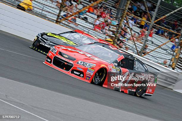 July 2015 | Kurt Busch Haas Automation Chevrolet SS passes Clint Boyer 5-hour Energy Toyota Camry during the NASCAR Sprint Cup 22nd Annual Crown...