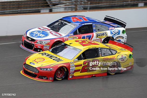 July 2015 | Joey Logano Shell/Penzoil Ford Fusion puts AJ Allmendinger Kroger/Kingsford Charcoal Chevrolet SS a lap down during the NASCAR Sprint Cup...