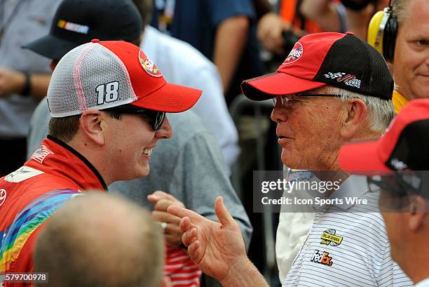 July 2015 | Kyle Busch Skittles Toyota Camry receives congratulations from Joe Gibbs in victory lane after winning the NASCAR Sprint Cup 22nd Annual...