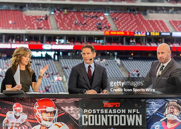 Analysts Suzy Kolber, Steve Young and Trent Dilfer prepare for the camera during the NFL Wild Card game between the Kansas City Chiefs and Houston...