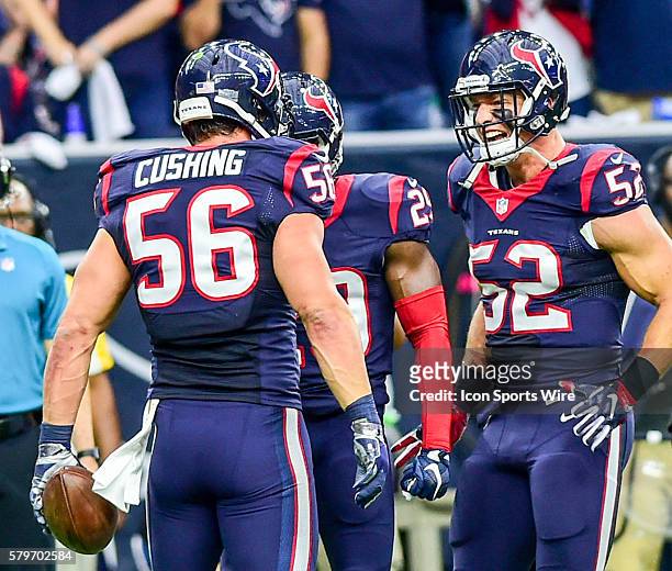 Houston Texans linebacker Brian Peters is all smiles as he approaches to congratulate Houston Texans linebacker Brian Cushing on his first half...